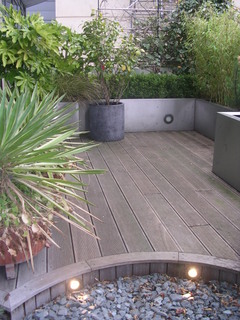 balcony Leeds Yorkshire decking and steel planter with box hedge climbers and architectural lush planting modern contemporary design