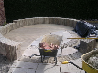 landscaping garden construction yorkshire circular patio stone paving with stone laid on edge cobbles low circle patio wall 
