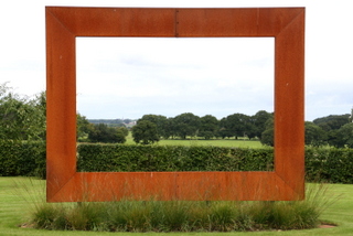 steel frame sculpture in rural yorkshire garden grasses beneath floating frame long distance view across countryside contemporary garden design