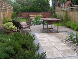 long terrace garden yorkshire slate paving cobbles modern landscaping dog area in garden fenced off