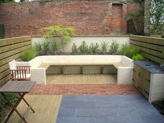 courtyard garden York with in built rendered seating decking and brick paving timber fencing contemporary garden design