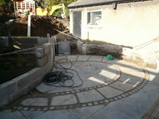 block retaining wall circular pattern paving and setts Yorkshire landscaping garden construction