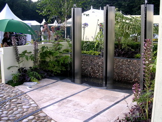 RHS Tatton show garden cobble and stone paving with slate detail, steel water feature 